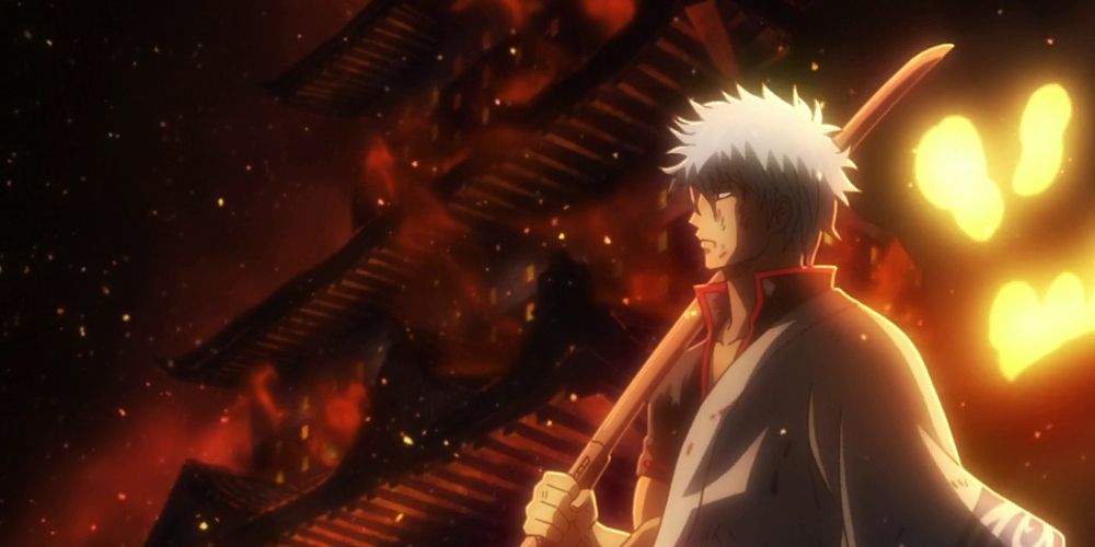 Gintoki holds a sword over his shoulder in Gintama