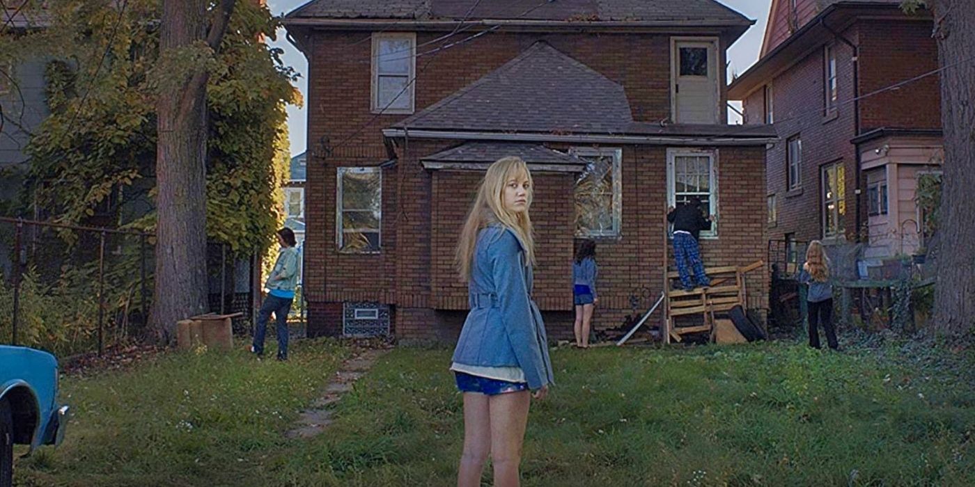 Jay standing in front of a house in It Follows