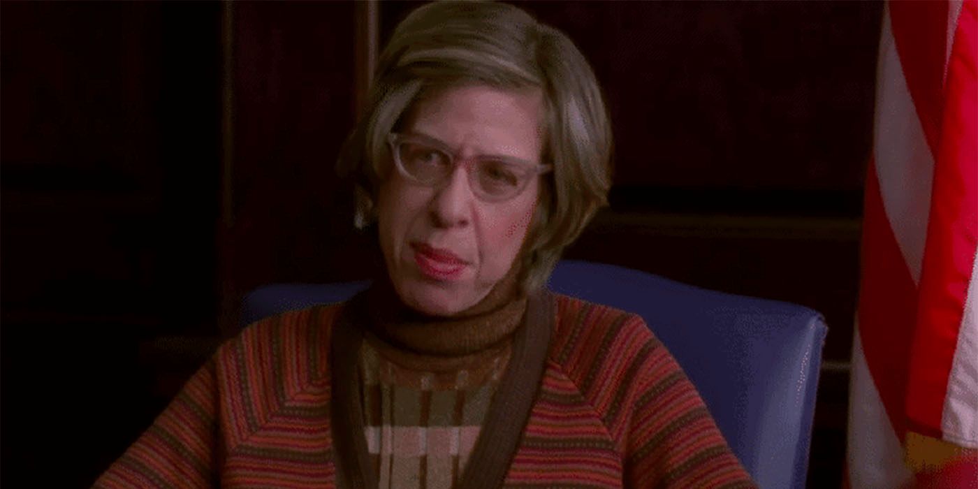 Jackie Hoffman, sitting in a chair looking in a scene from her role in 30 Rock.