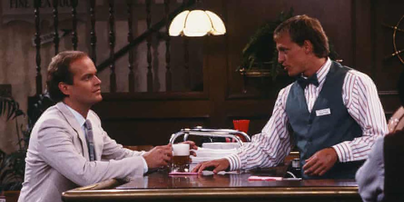Dr. Frasier Crane sitting at the bar, Woody serving him in a scene from Cheers.