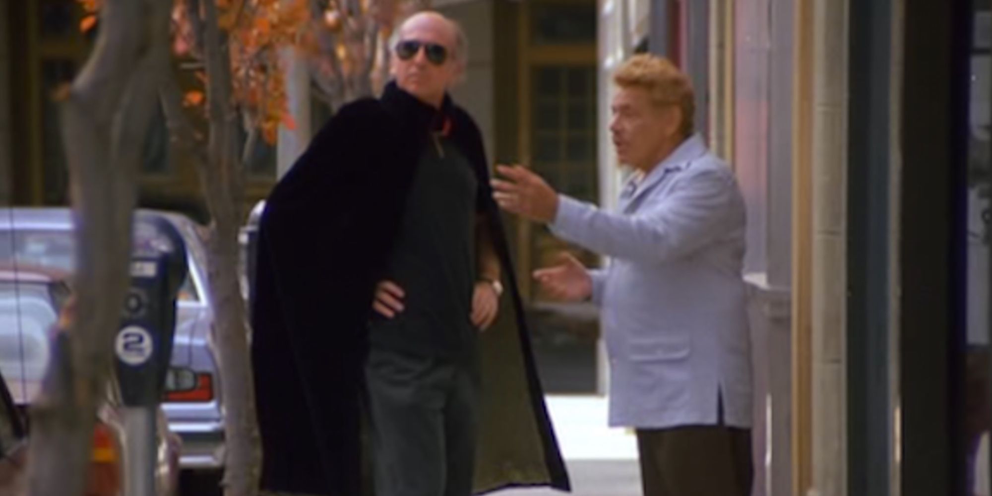 Larry David as the man in the cape