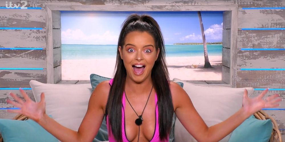 Maura holds her arms out on the couch on Love Island UK