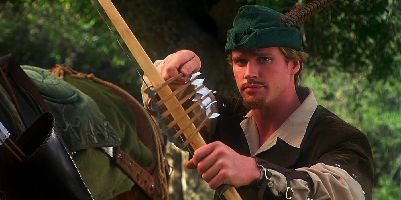 A man points a bow with many arrows in it in Robin Hood Men in Tights
