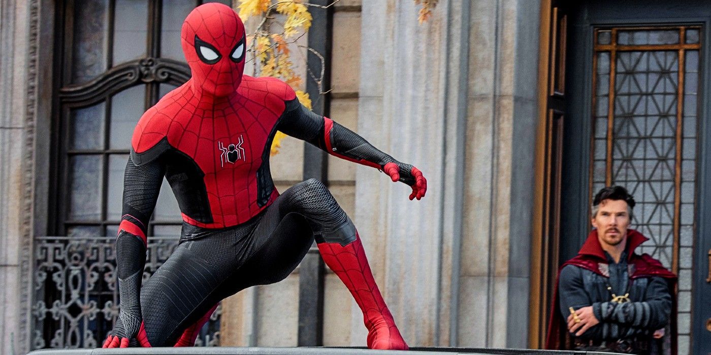 Spider-Man sits on a ledge as Doctor Strange looks on in Spider-Man: Far From Home.