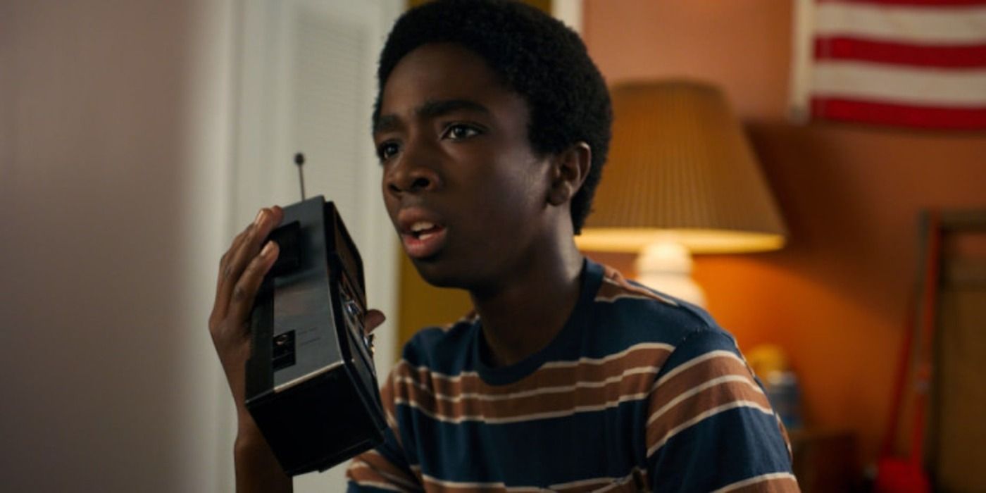 Lucas uses a walkie talkie in his room in Stranger Things.