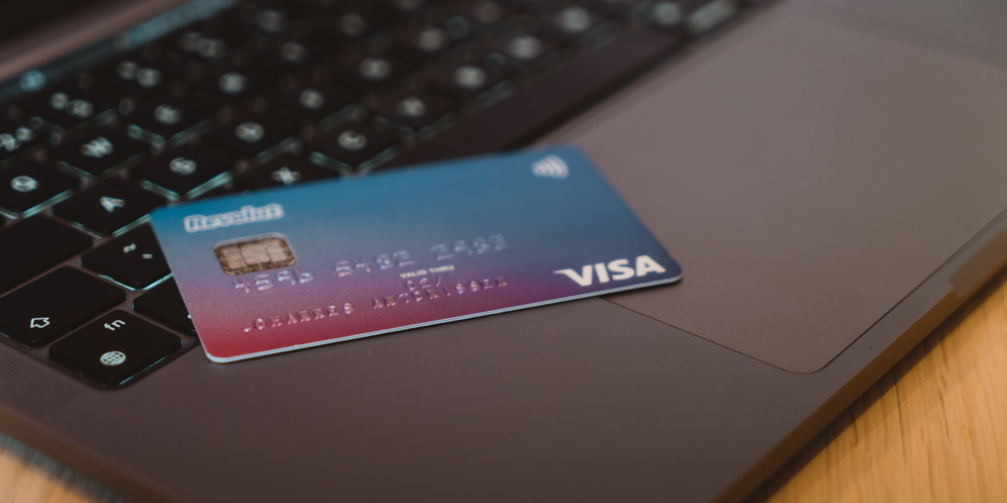 Photo of a Visa card on a laptop