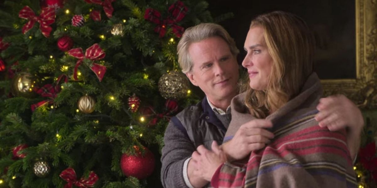 Cary Elwess putting a blanket around Brooke Shields in A Castle For Christmas