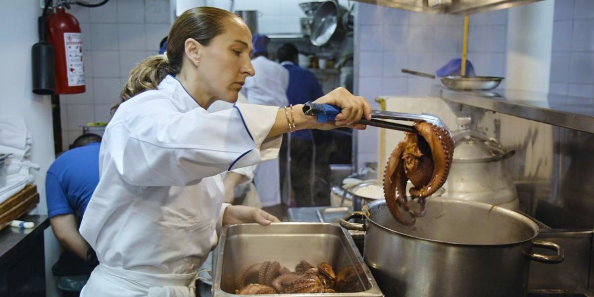 Gabriela cooks seafood in A Tale Of Two Kitchens.