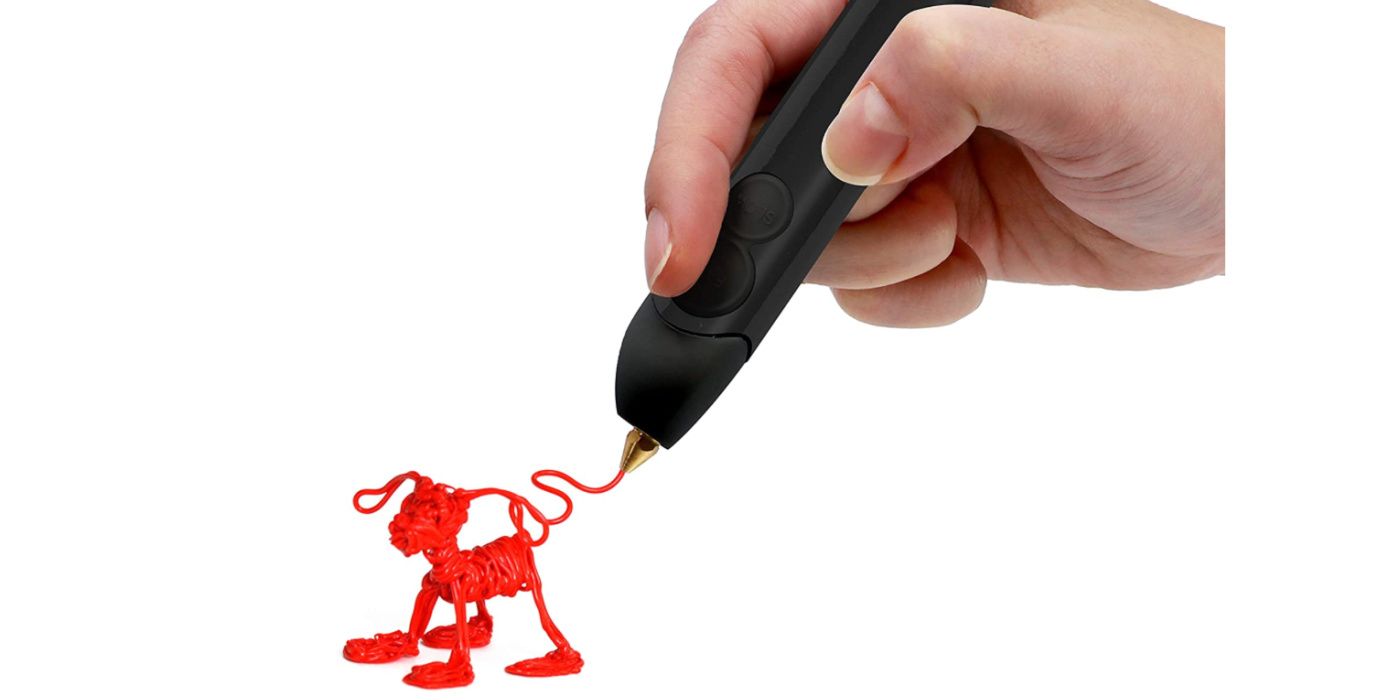 A hand draws a puppy with a 3D printing pen