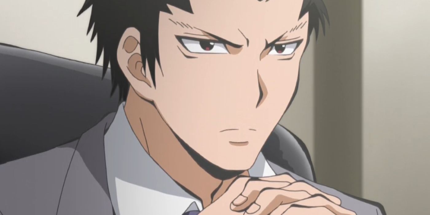 Tadaomi with his hand intertwined looking serious in Assassination-Classroom