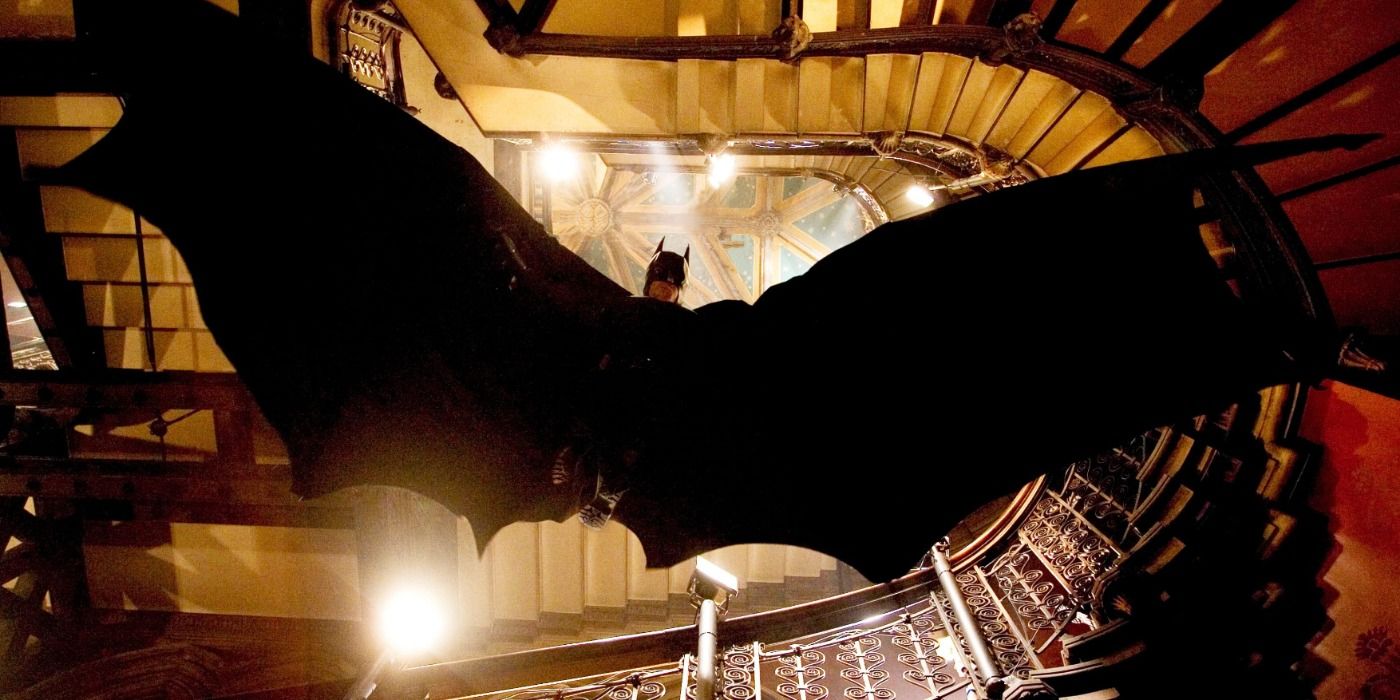 Batman gliding down the stairwell of Arkham Asylum in Batman Begins