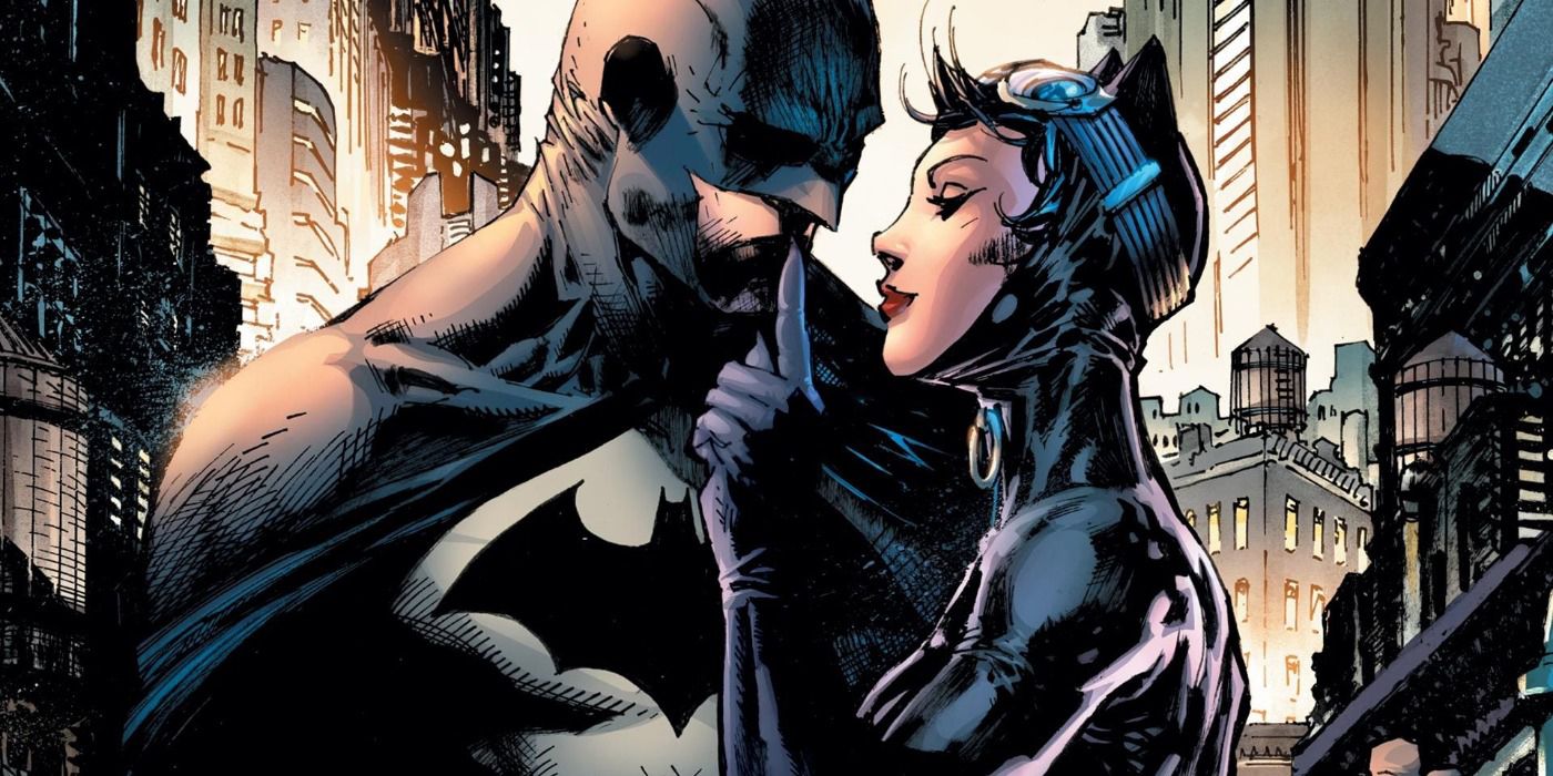 Batman holding Catwoman.