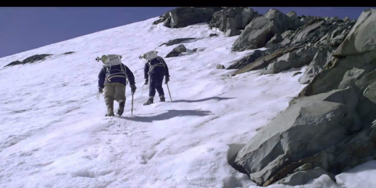 An image of climbers hiking up a mountain in Beyond the Edge