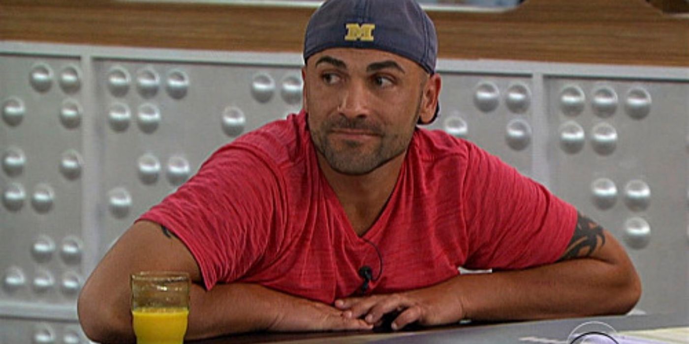 Willie Hantz smiling while sitting on the counter in the Big Brother house