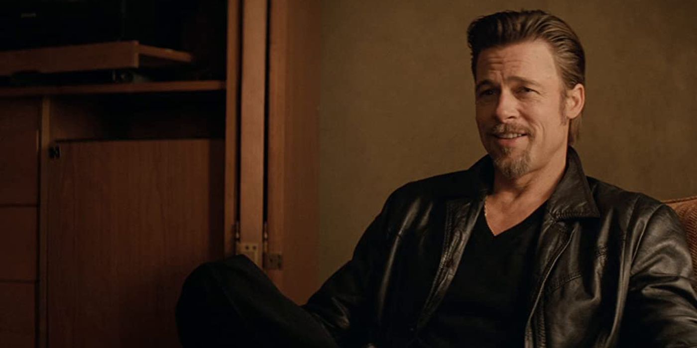 Bradf Pitt sitting down in Killing Them Softly.