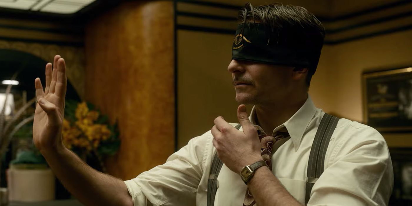 Stanton Carslile wearing a blindfold in Nightmare Alley