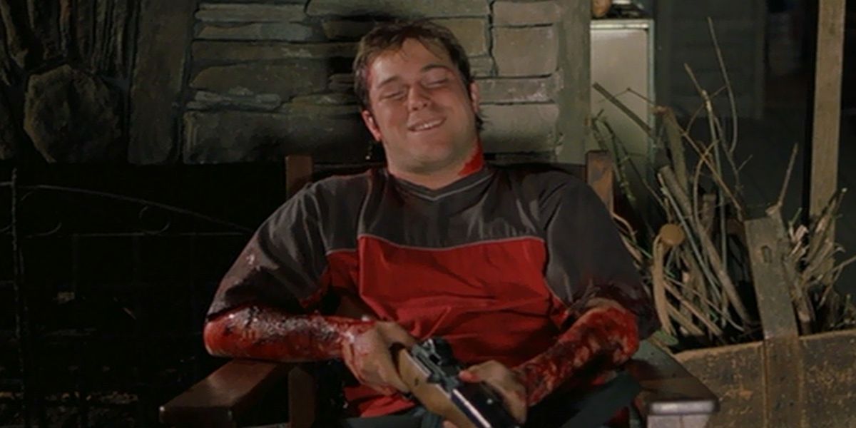 Bert holding a rifle in the 2002 horror movie Cabin Fever.