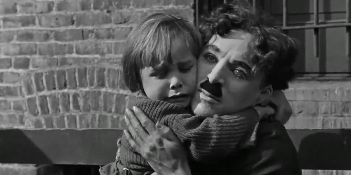 Chaplin hugs Jackie Coogan in the Kid 