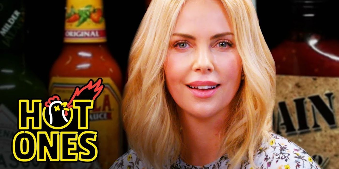 Charlize Theron looks at the camera while on Hot Ones