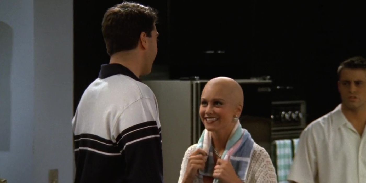 Bonnie smiles after shaving her head while Ross and Joey look on in Friends