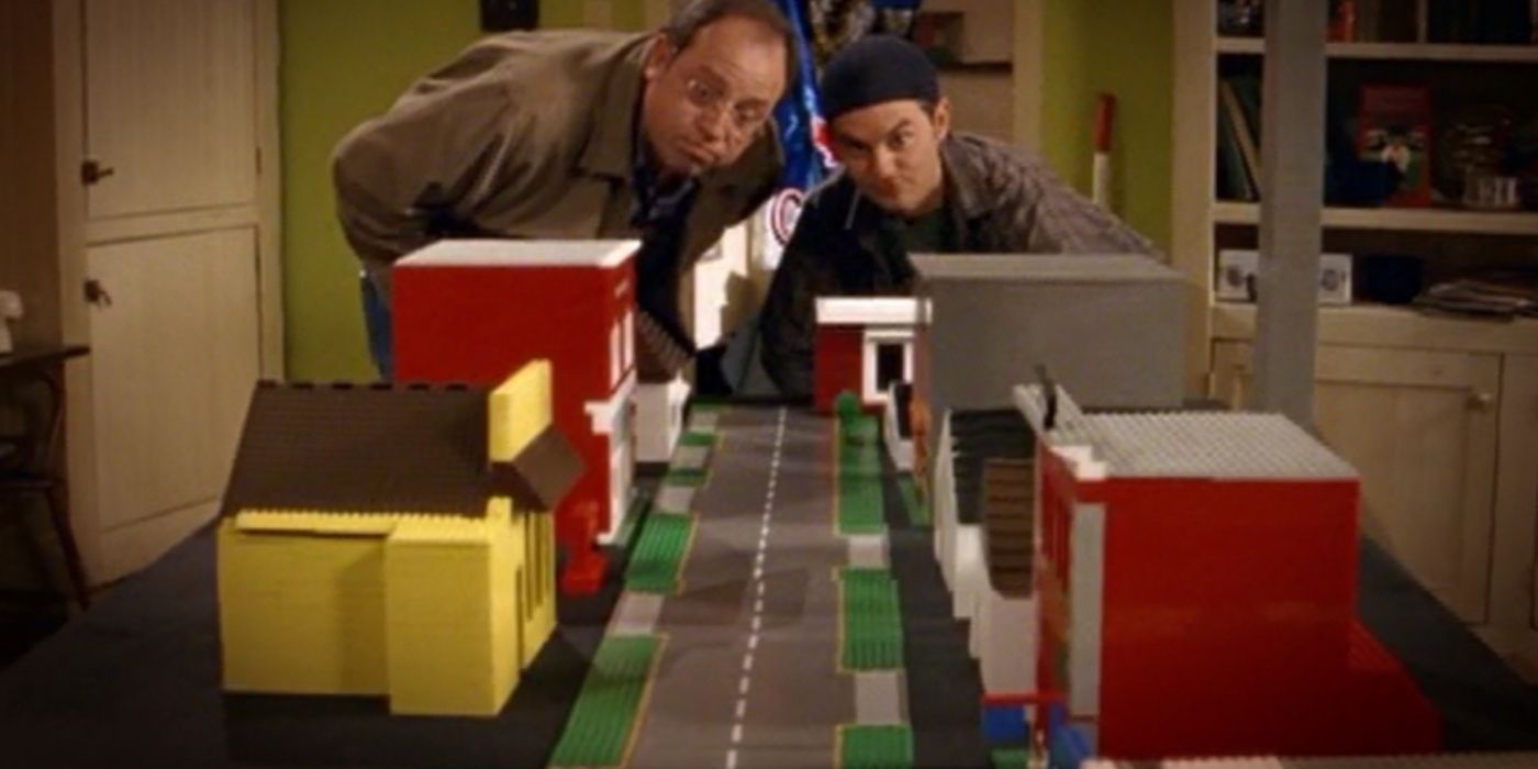 Two men looking at a toy city in Corner Gas