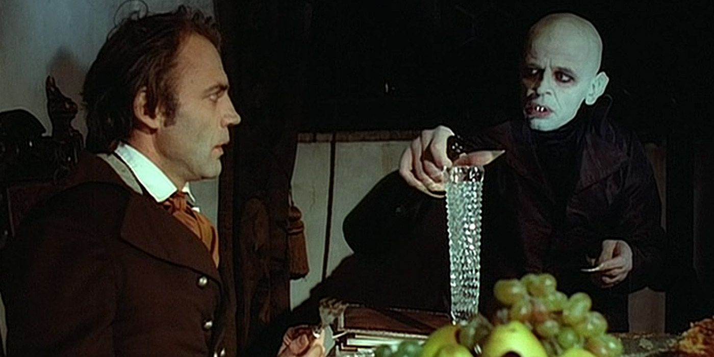 Jonathan Harker having dinner with Count Dracula in Nosferatu The Vampyre