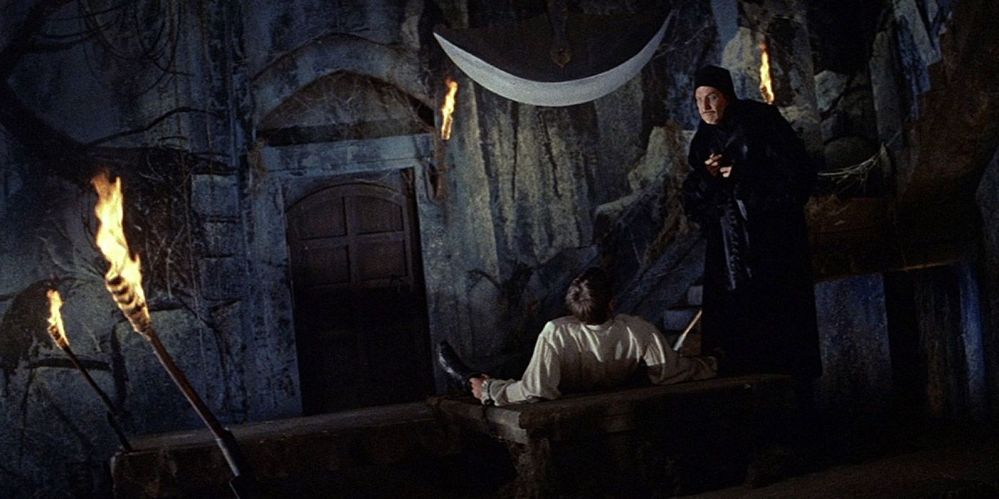Prospero straps a victim to the pendulum device in The Pit &amp; The Pendulum