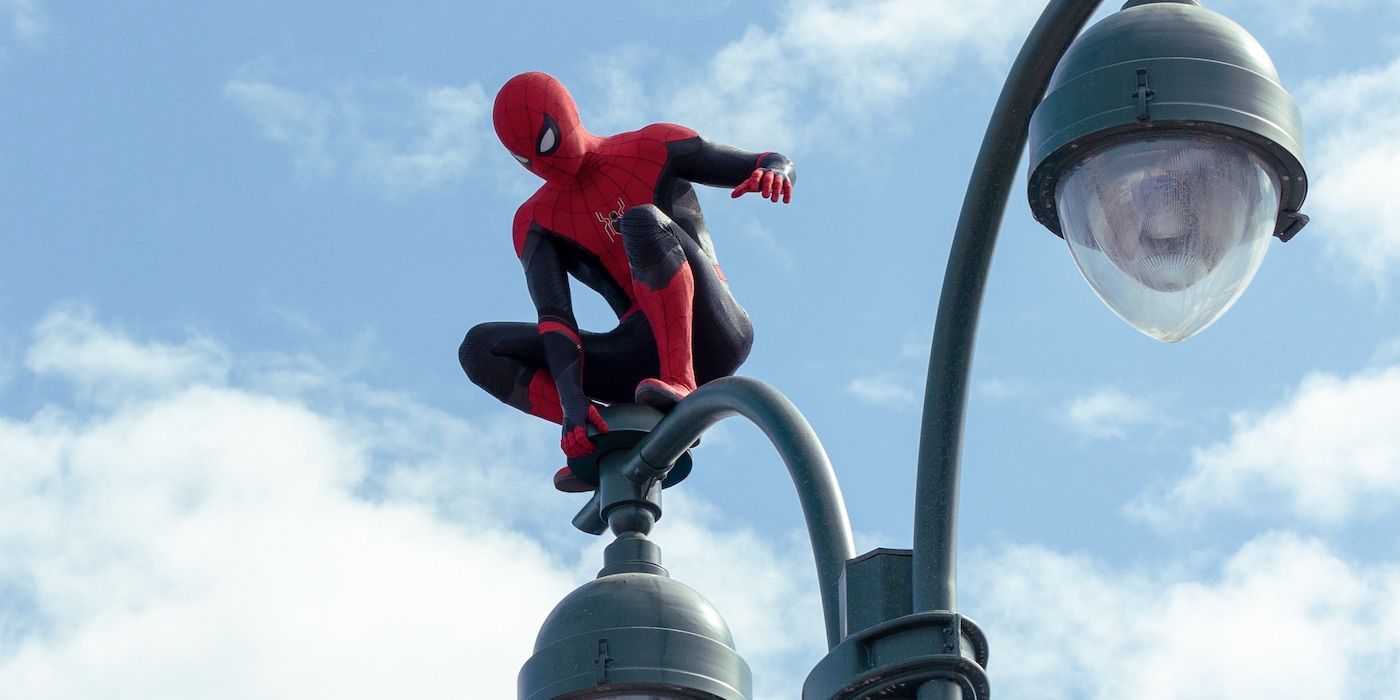 Spider-Man balancing on a lamp post in No Way Home
