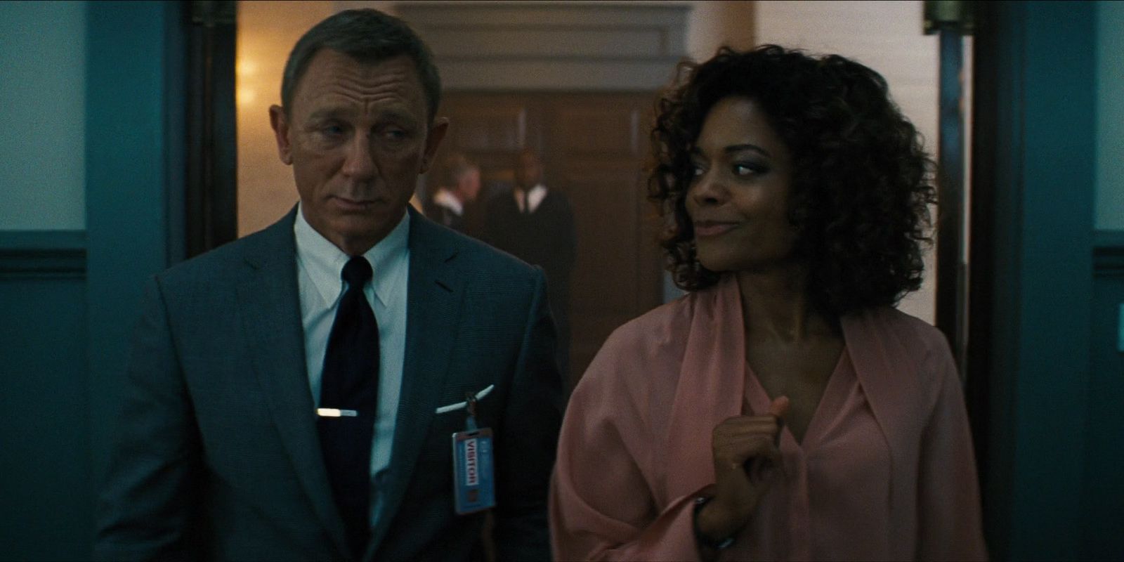 Daniel Craig as James Bond and Naomie Harris as Moneypenny in No Time To Die