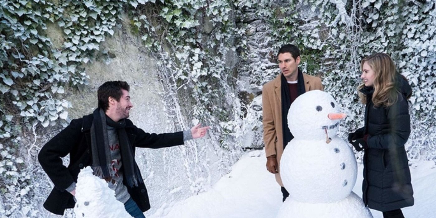 Darcy and Tom build snowmen in Christmas Perfection