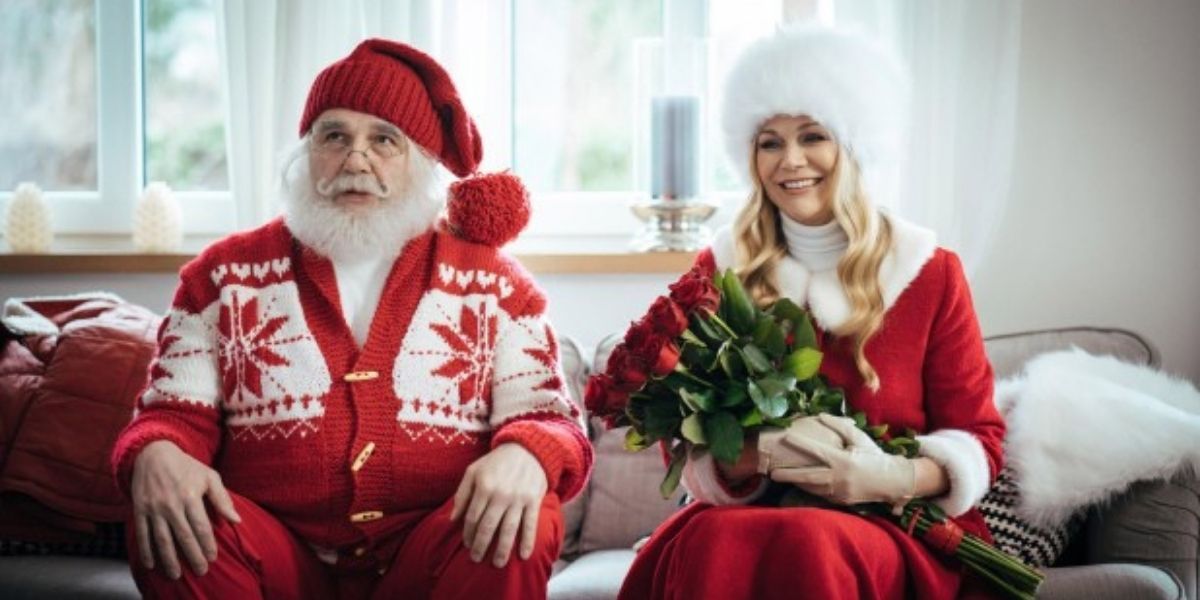 Santa and Mrs. Claus sitting on the couch in David and the Elves