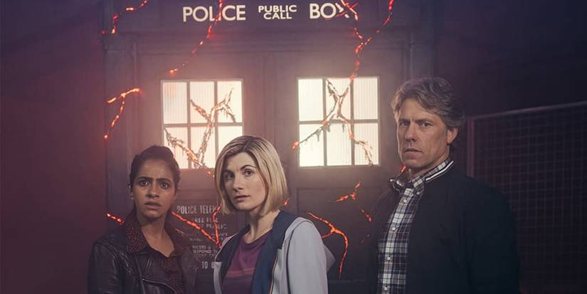 The Doctor, Yaz, and Dan stood in front of the TARDIS in Doctor Who season 13.