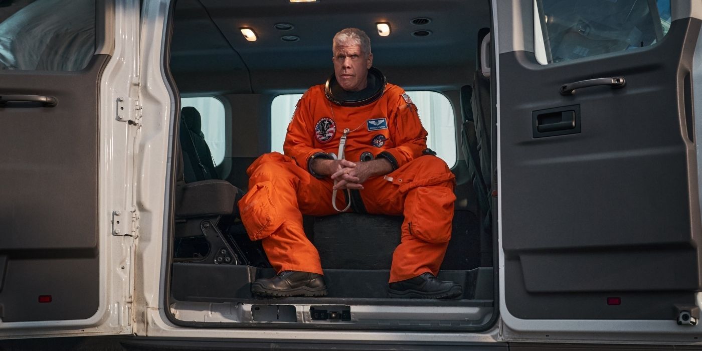 Benedict Drask in an astronaut suit sitting in a van in Don't Look Up