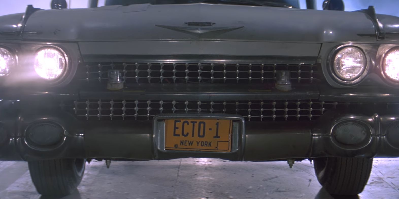 Ecto-1 being unveiled inside the firehouse in Ghostbusters 1984
