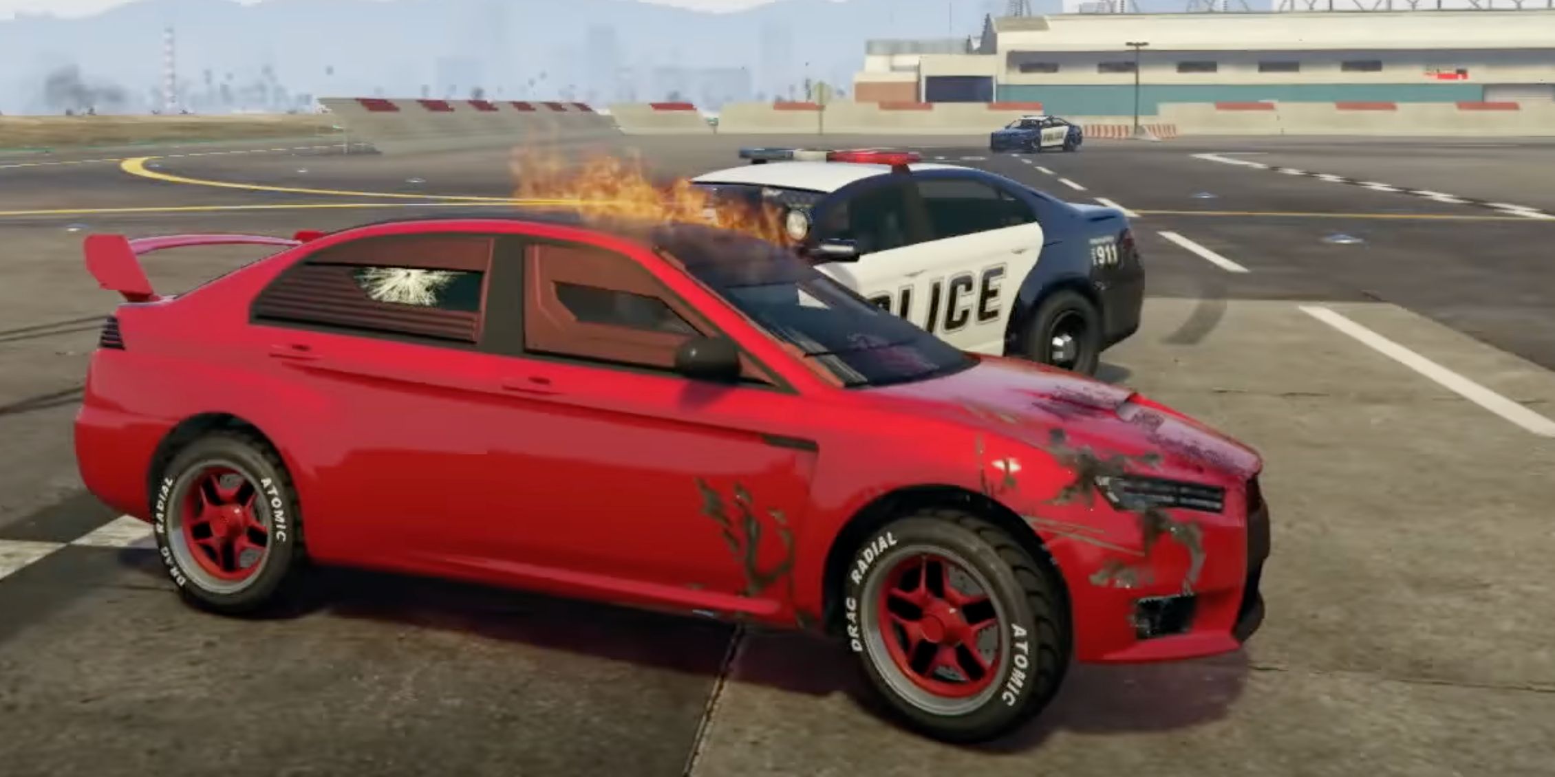 A car in GTA Online that has been smashed up and ruined by police