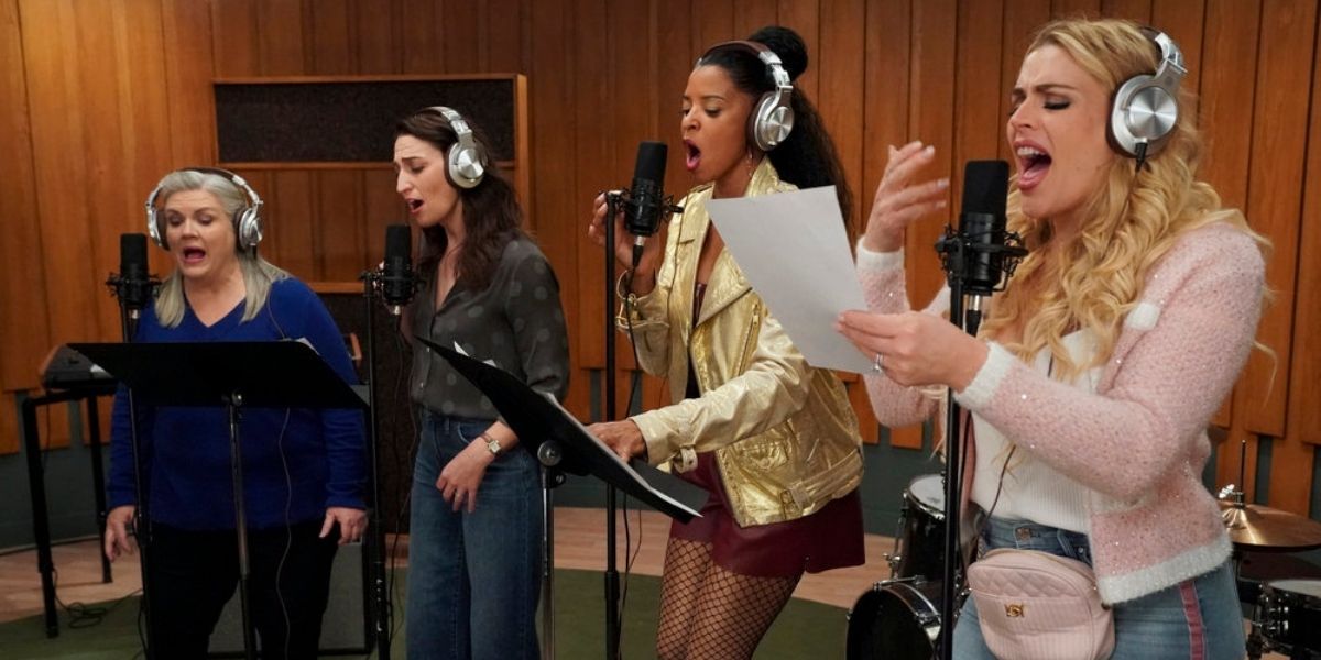 The cast of Girls5Eva singing in the recoding booth