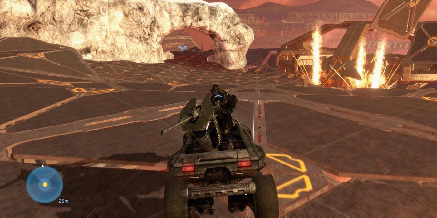 A vehicle is driven over a battleground in Halo 3