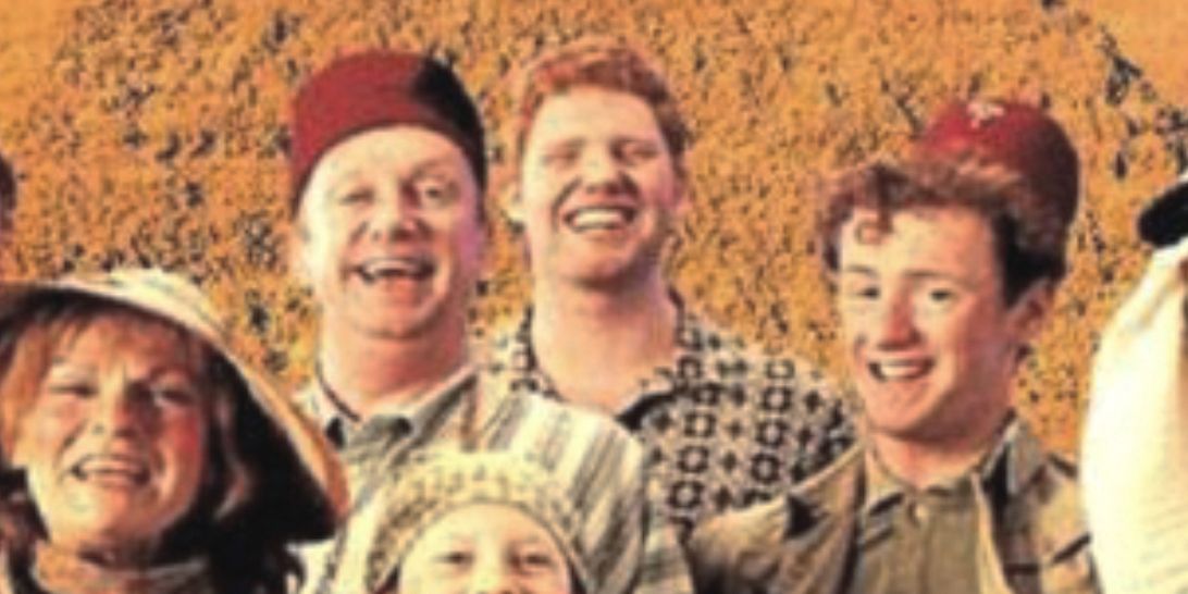 Charlie Weasley smiles in a Weasley family photo