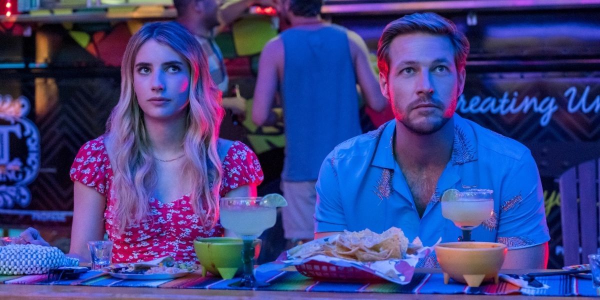 Sloane and Jackson eating nachos next to each other in Holidate