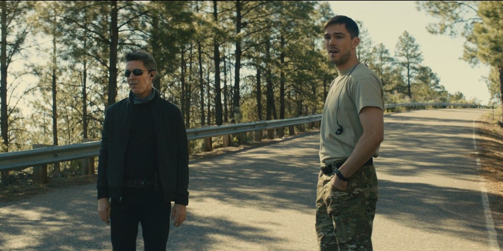 Jack and Patrick standing on the road in Those Who Wish Me Dead