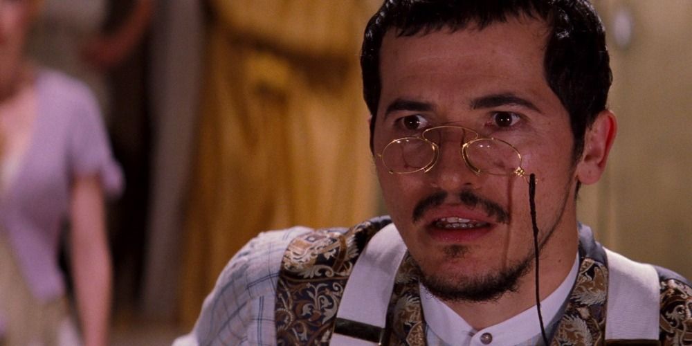 John Leguizamo with glasses on in Moulin Rouge looking surprised