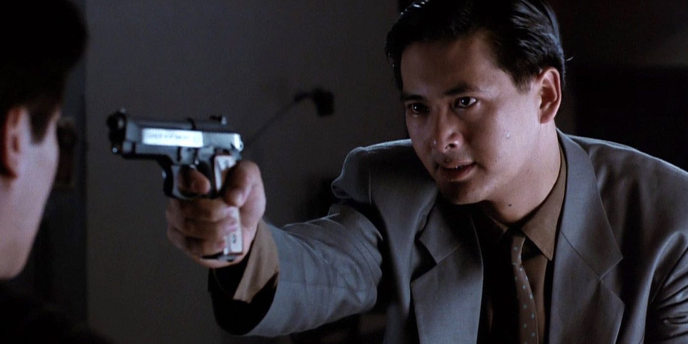 Ah Jong holding a gun in The Killer