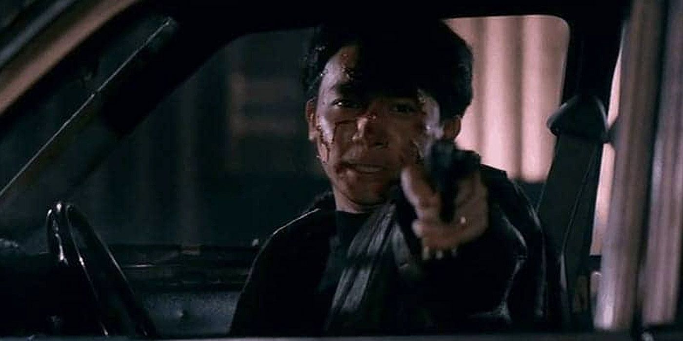Ben aiming a gun from a car in Bullet In The Head