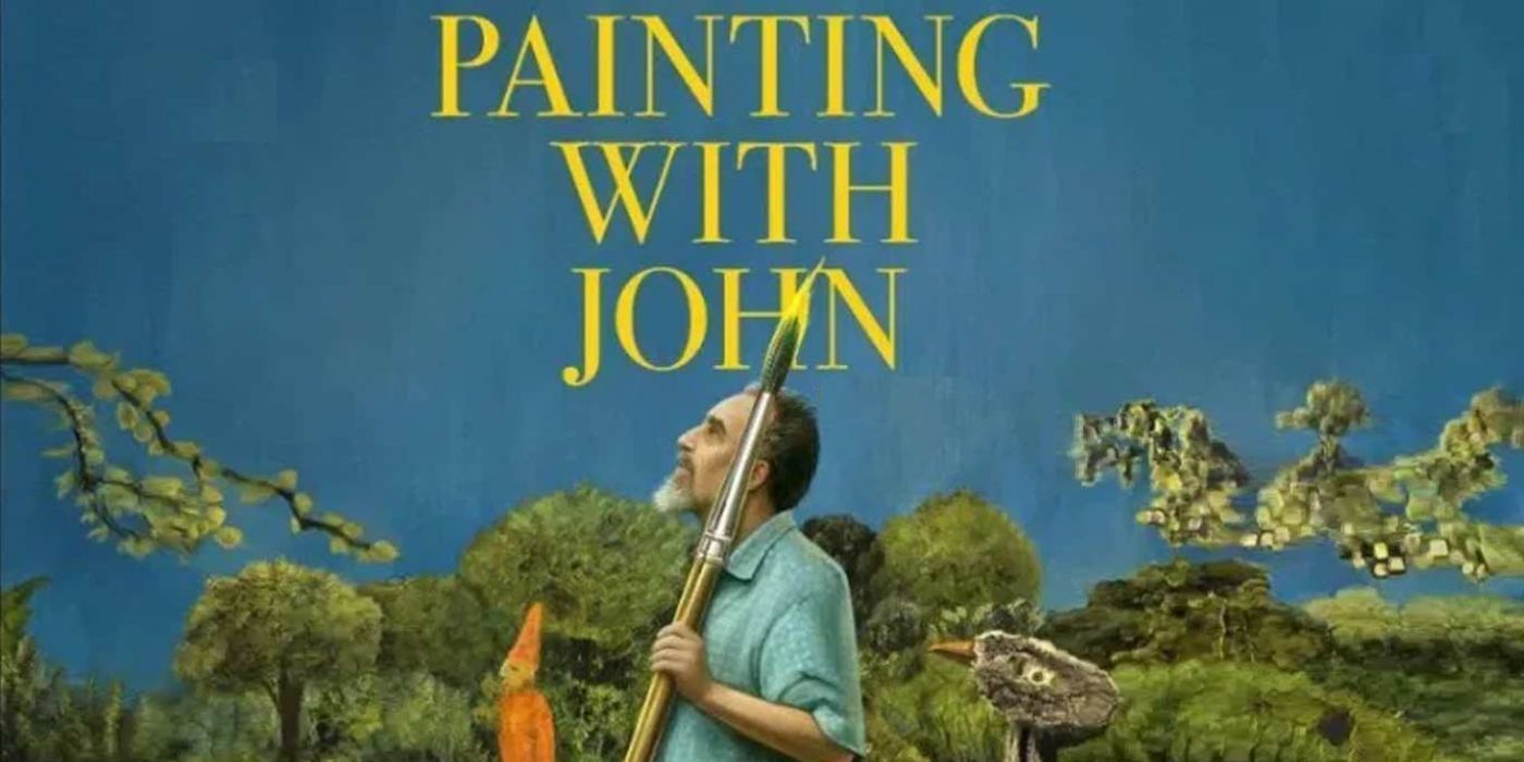 John holding a brush in Painting With John