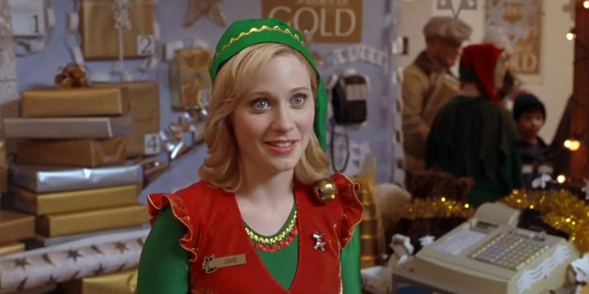 Jovie stands at the register in Gimbels in Elf