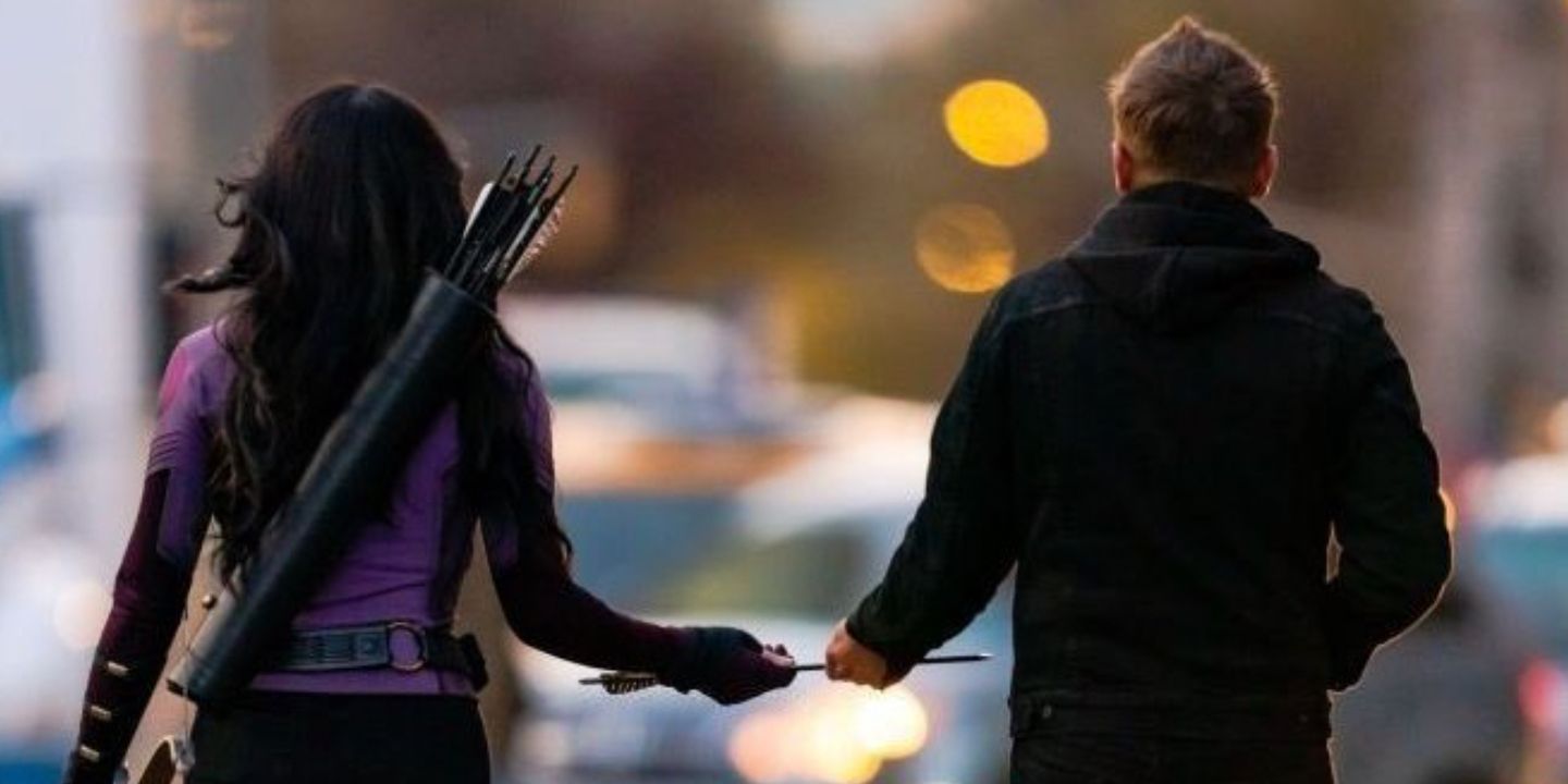 Kate Bishop and Clint Barton walk away holding an arrow between them in Hawkeye episode 5