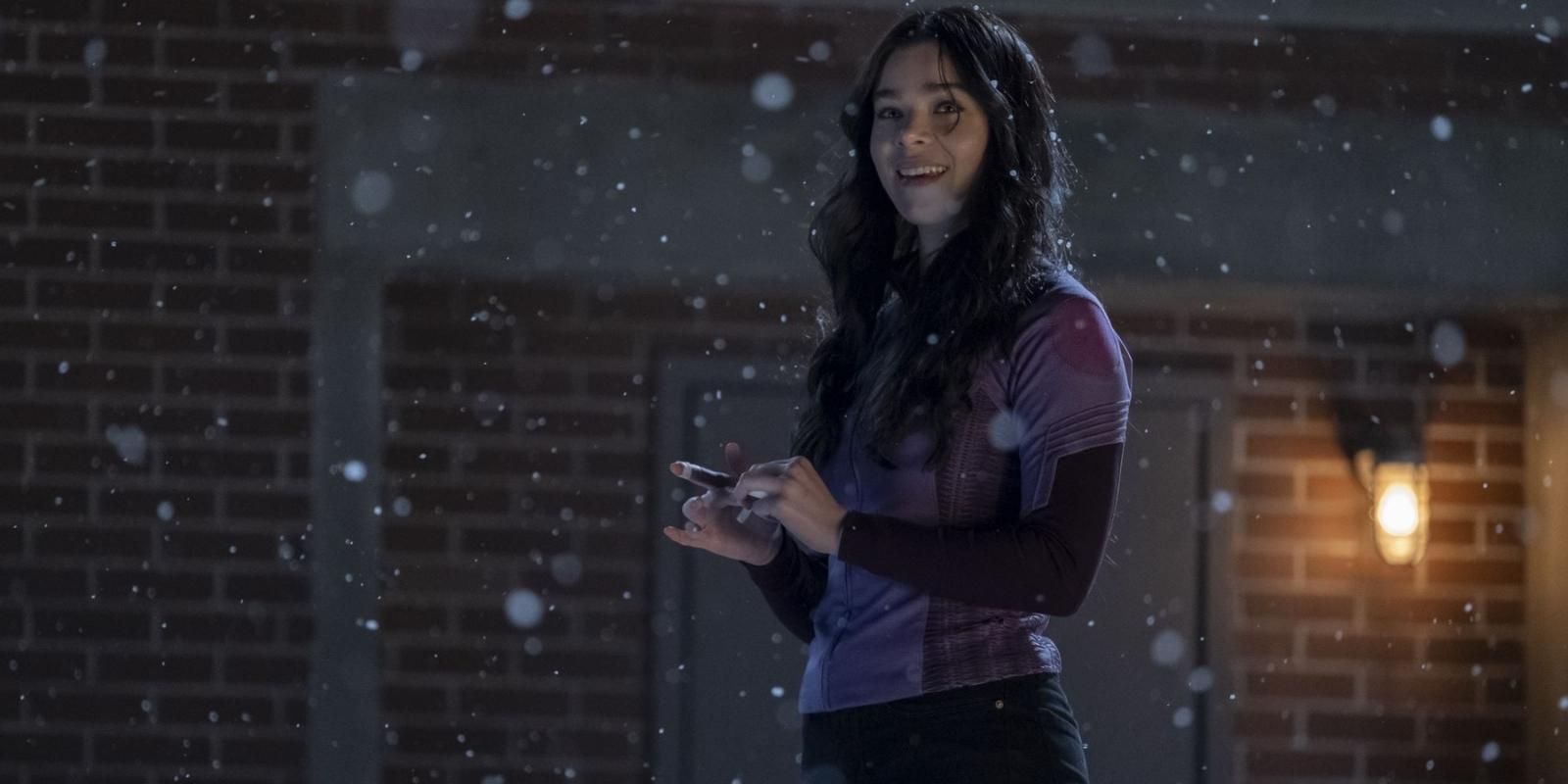 Kate Bishop smiles in the snow in her archery shirt in Hawkeye