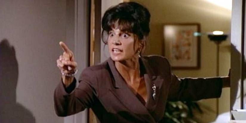 Kate Costas pointing off-screen in Frasier
