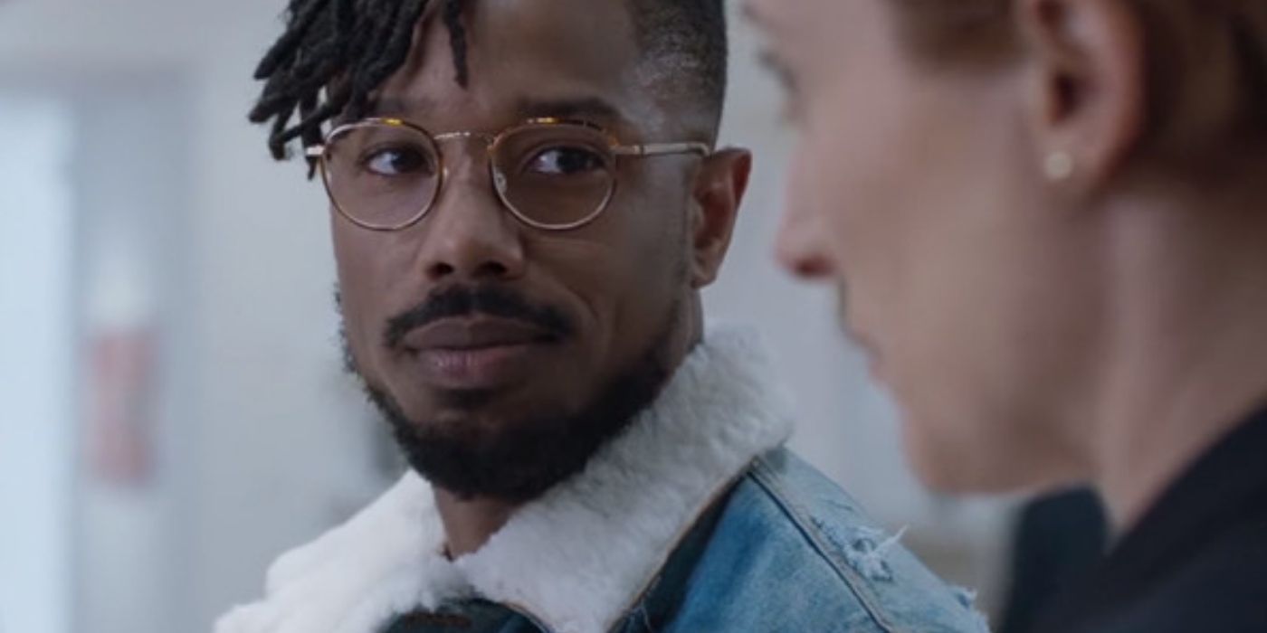 Killmonger looking at a museum curator and smiling