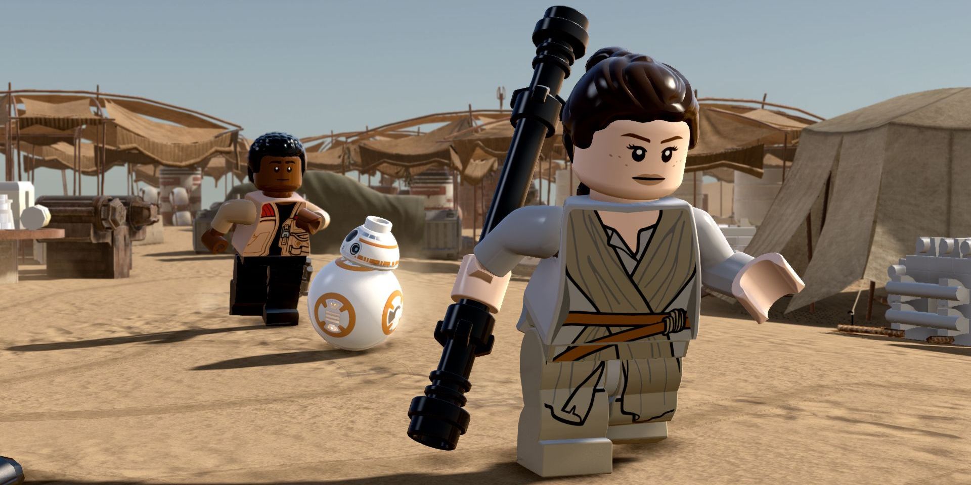 A screenshot of Ray, Finn, and BB8 from LEGO Star Wars The Force Awakens.